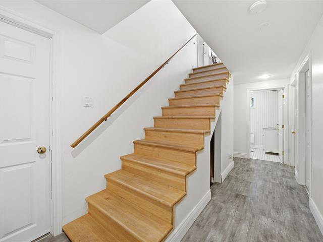 Wooden staircase leading to the basement